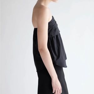 Black strapless oak + fort top with gathered detail.